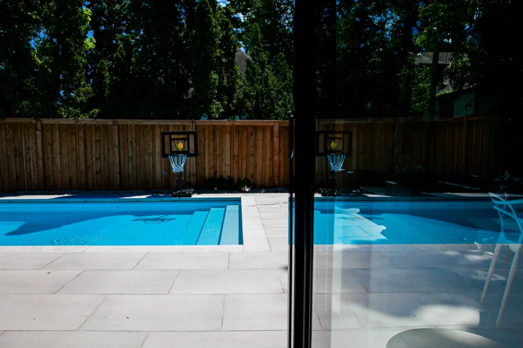 Flagstone patios, interlock walkways, concrete decks, retaining walls — all designed to match your pool perfectly.