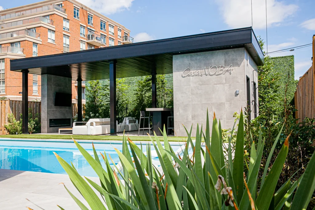 pool contractor in Toronto, Destination Pools & Landscaping. Shrubs and cabana area