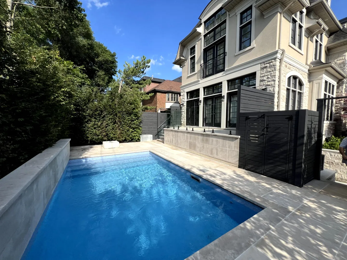 Vinyl-lined inground pool in a Toronto backyard by Destination Pools and Landscaping