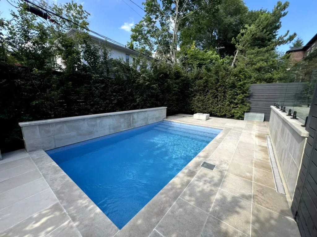 Toronto Small Backyard Pool with Retaining Wall backdrop for lap pool