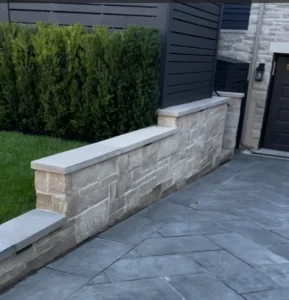 Residential retaining walls in frontyard of property in Toronto, built by Destination Pools & Landscaping